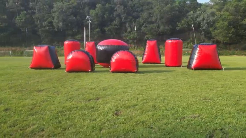 Inflatable Nerf battle barriers set up on a grass field